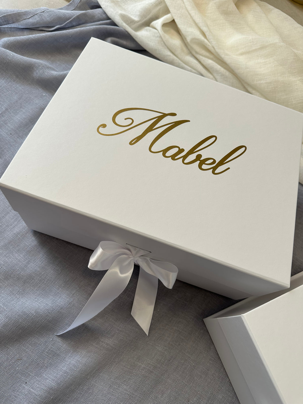 White gift box personalized with the name Mabel